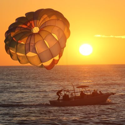 a parachute is sitting next to a body of water