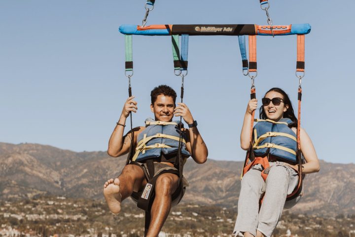a man standing next to a body of water